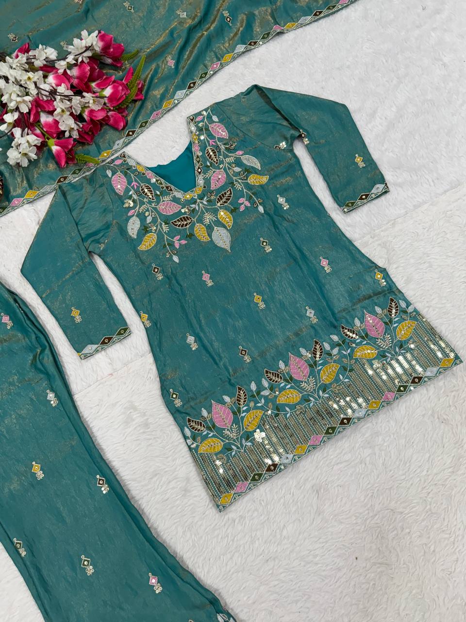 Elegant Rust Orange Silk Kurta and Flared Palazzo Set Adorned with Intricate Multicolored Botanical Embroidery and Mirror Work